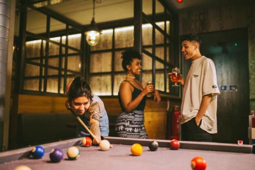 a man and a woman playing a game of ping pong at Generator London in London