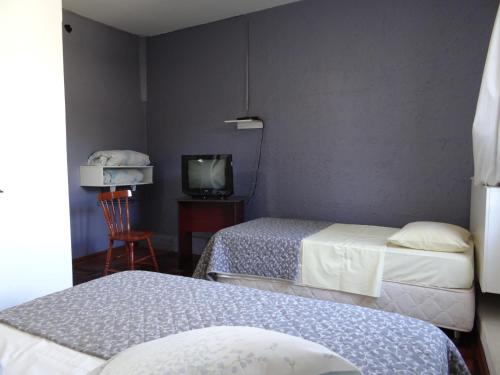 Voodi või voodid majutusasutuse Roma Hotel toas