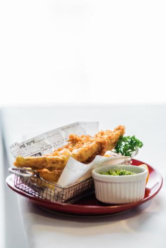 a plate of food with chicken and fries and dip at Highfield Park in Hook
