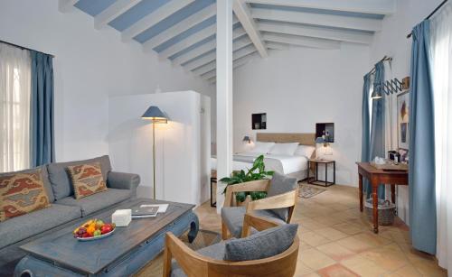 a living room with a couch and a bed at Hotel San Lorenzo - Adults Only in Palma de Mallorca