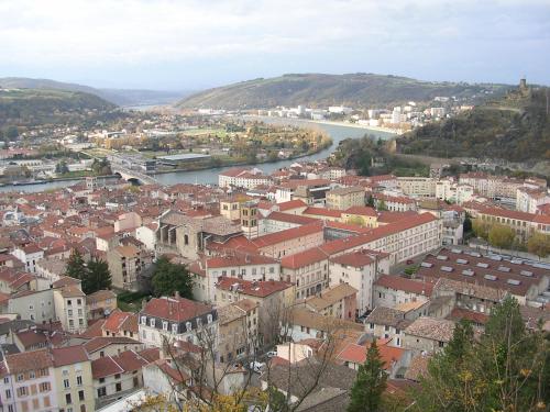 a view of a city with a river and buildings at ibis budget Vienne Sud in Vienne