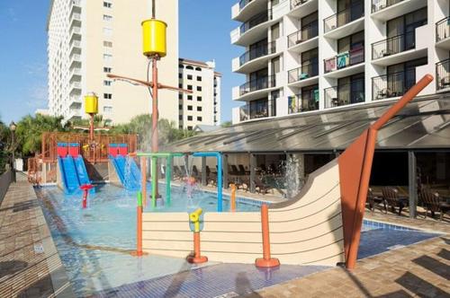 a water park with a slide and a playground at JeffsCondos - 3 Bedroom - Breakers Resort in Myrtle Beach