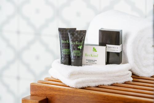 a pile of towels and products sitting on a shelf at Hotel Spero in San Francisco