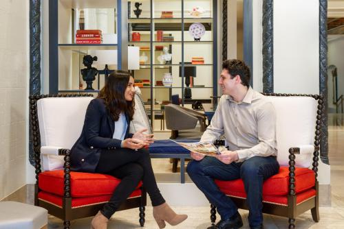 a man and a woman sitting in chairs in a store at Hotel Spero, Vignette Collection by IHG in San Francisco