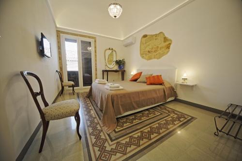 Posteľ alebo postele v izbe v ubytovaní Palazzo Torre Apartment