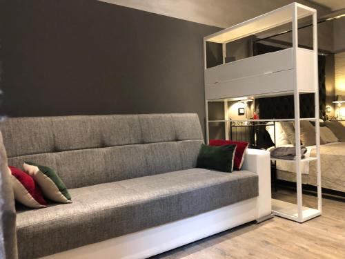 a living room with a couch and a bunk bed at Villa Tower Inn in Pisa
