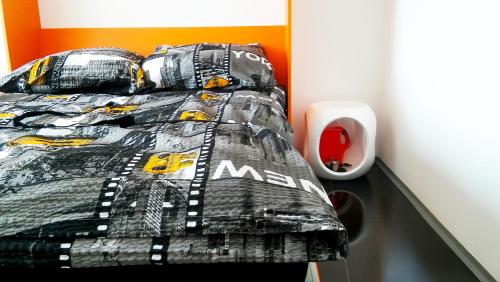 a bedroom with a bed with a race car comforter at Walk distance to mokotow business park in Warsaw