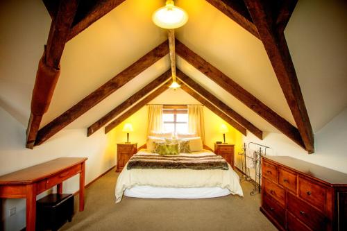 A bed or beds in a room at Glenorchy Lake House