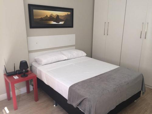 Ліжко або ліжка в номері apartamento luxo copacabana