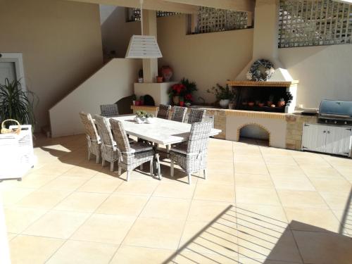 a dining room with a table and chairs at Endless Blue in Anavissos