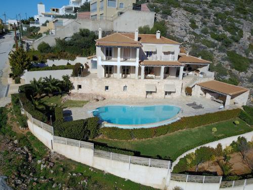 an aerial view of a house with a swimming pool at Endless Blue in Anavissos