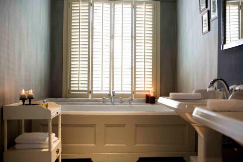 
Een badkamer bij Suitehotel Posthoorn
