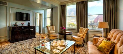 a living room with a couch and a table at Taj Cape Town in Cape Town