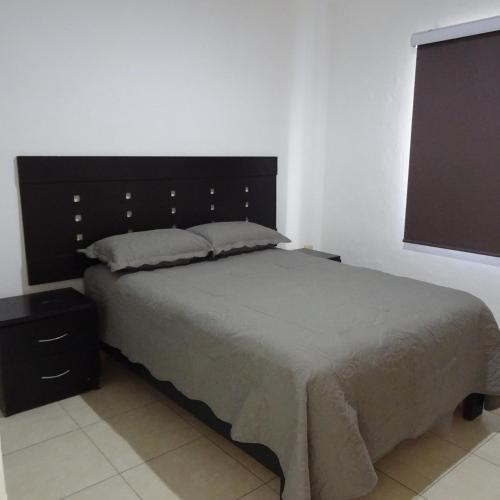 En eller flere senge i et værelse på Casa Libertad