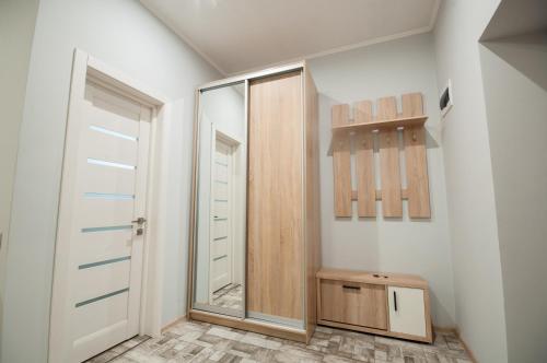 a bathroom with a shower and a glass door at Wonderful flat on city center (Mukachivska 4/15) in Uzhhorod