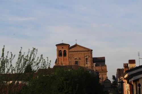 an old building with a cross on top of it at Green House in campagna in Melara