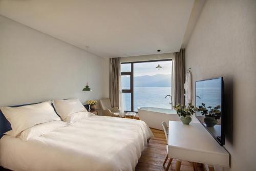 Galeriebild der Unterkunft Yuanshanqing·Stone Hill Seaview Guesthouse in Dali