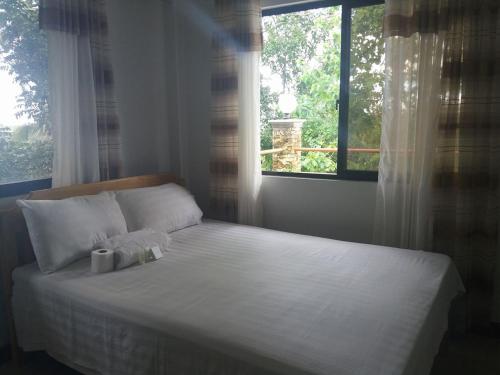 Postel nebo postele na pokoji v ubytování Villa Feliza