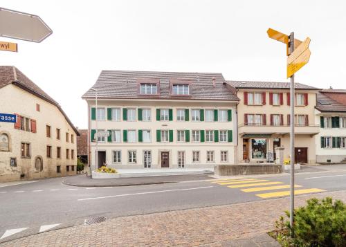an empty street in a town with buildings at Aparthotel Bären in Seengen