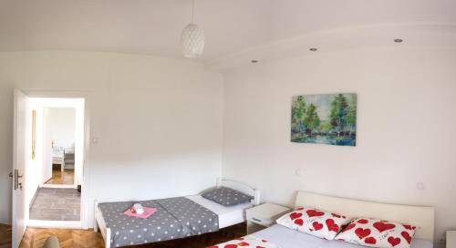 Postel nebo postele na pokoji v ubytování Apartmani Bridge