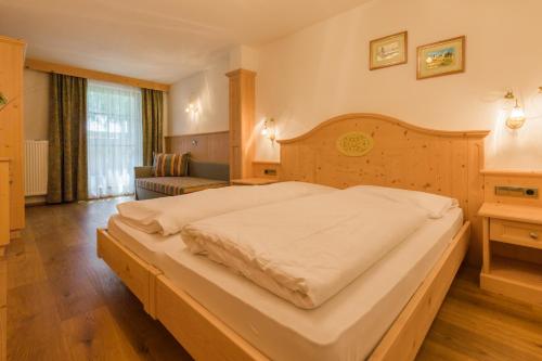 Ένα ή περισσότερα κρεβάτια σε δωμάτιο στο Residence Grüne Laterne - Lanterna Verde