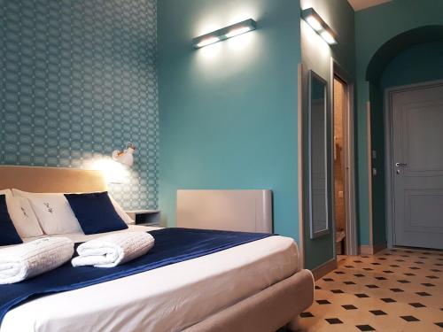 Katil atau katil-katil dalam bilik di Don Ugo Luxury Rooms
