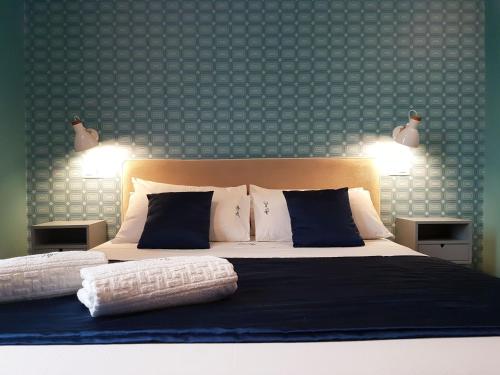 Katil atau katil-katil dalam bilik di Don Ugo Luxury Rooms