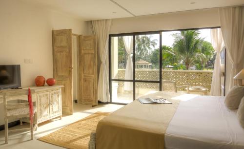 Giường trong phòng chung tại Sandies Malindi Dream Garden