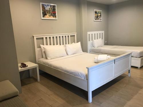 Ένα ή περισσότερα κρεβάτια σε δωμάτιο στο Paragon Inn