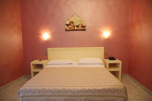 Postel nebo postele na pokoji v ubytování Hotel PRINCIPE AMEDEO