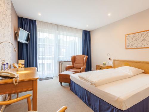 Llit o llits en una habitació de Landhotel Weserblick