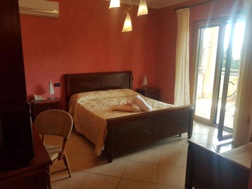 a bedroom with a bed with a person laying on it at Agriturismo Terre Delle Monache in Pontecagnano