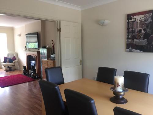 a dining room with a table and chairs at Highbury House, Warm and Welcoming. in Darlington