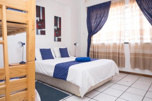 a bedroom with two bunk beds and a window at Seabrook 308 Cottage in Margate