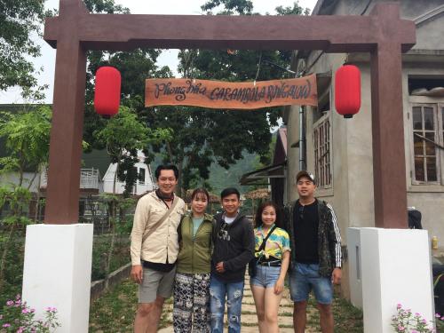 a group of people standing in front of a monument at Carambola Bungalow in Phong Nha