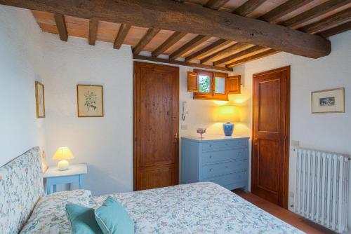 Postel nebo postele na pokoji v ubytování Santa Lucia Suite Camaiore