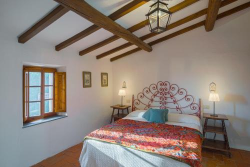 Postel nebo postele na pokoji v ubytování Santa Lucia Suite Camaiore
