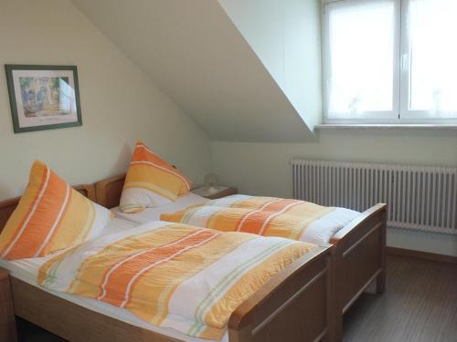 Postel nebo postele na pokoji v ubytování Gästehaus Neises