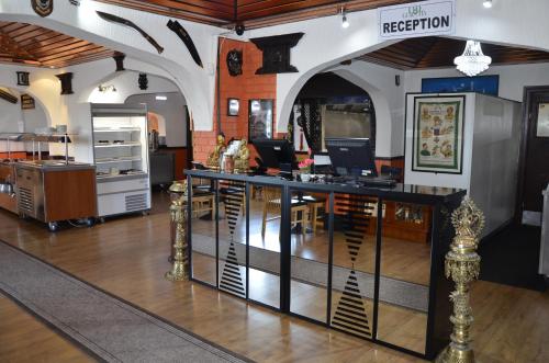 a living room with a table and chairs in it at The Gurkha Hotel in Blackpool