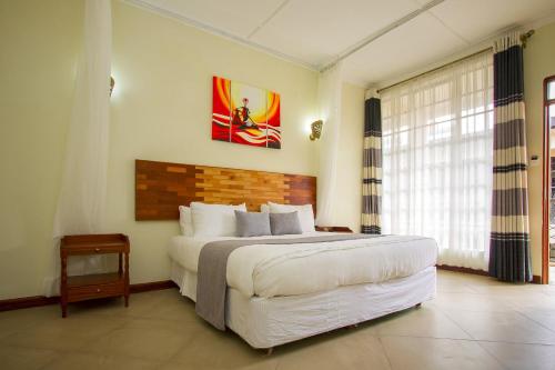 Ένα ή περισσότερα κρεβάτια σε δωμάτιο στο The Smith Hotel