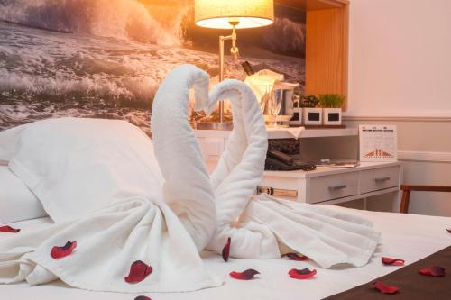 Postel nebo postele na pokoji v ubytování Hotel Ribes Roges