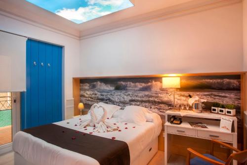 Postel nebo postele na pokoji v ubytování Hotel Ribes Roges