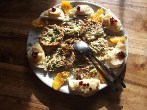 a plate of food on a wooden table at Gruberhof in San Genesio Atesino
