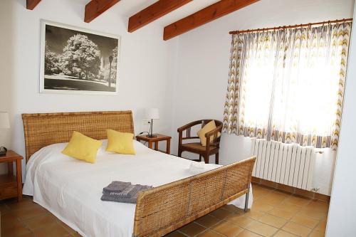 Un pat sau paturi într-o cameră la Villa Binigo