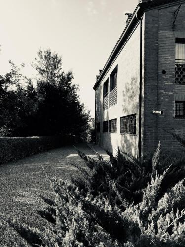 a black and white photo of a brick building at Podere Boschetto R&B in Bologna