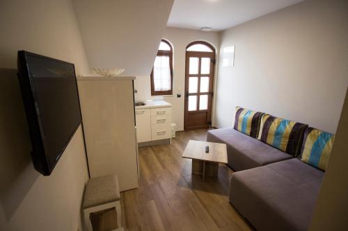 a living room with a couch and a table at Villa Divani in Mostar