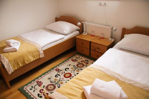 Postel nebo postele na pokoji v ubytování B&B Pod Skalo