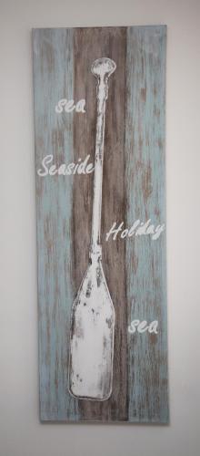 a painting of a glass bottle on a wall at La dimora di Clara in Trapani