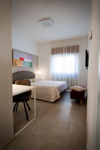 Una cama o camas en una habitación de Daniela B&B Fiera