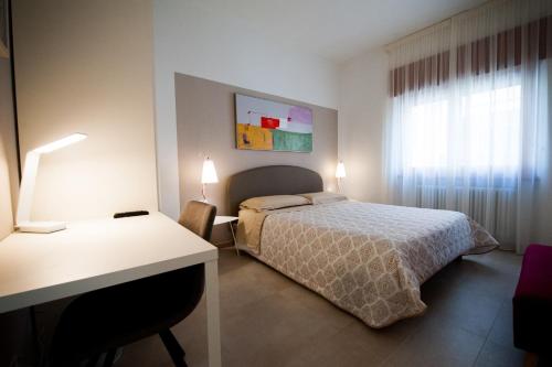 Una cama o camas en una habitación de Daniela B&B Fiera